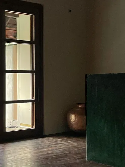 A simple, elegant detail in the Malenadu House, showcasing the interplay of light, wood, and plaster.