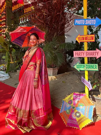 Your family's heirlooms are filled with stories, and I help you wear them. This vibrant pink Kanchi saree was transformed into a beautiful, flowing lehenga, allowing the bride to carry her heritage with her in a style that is completely her own.
