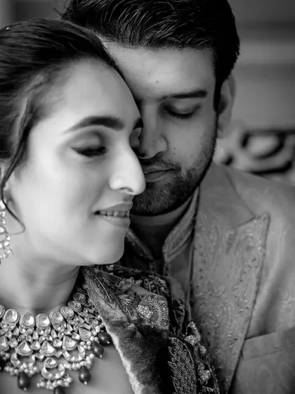 An intimate black and white close-up of the couple, capturing their love and connection.