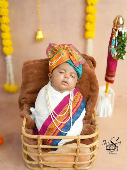 Another shot of the sleeping newborn, beautifully wrapped for his Gudi Padwa shoot. These are the precious, fleeting moments that you will cherish forever.