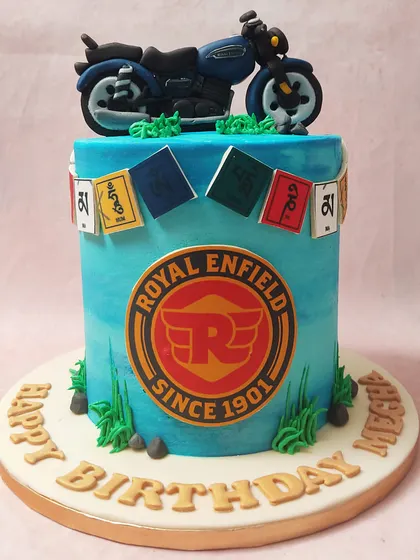 We capture the spirit of the open road with this Royal Enfield themed cake. A detailed fondant motorcycle sits atop a cake featuring the brand's logo and prayer flags, evoking a sense of adventure perfect for a biker's birthday.