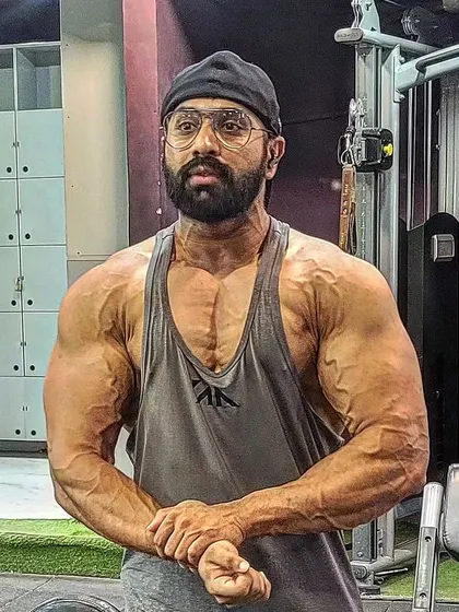 This was me four weeks out from the Sheru Classic. You can see the vascularity and conditioning coming through. My contest prep diet and peak week strategy are designed to get you this dry, shredded look under the stage lights.