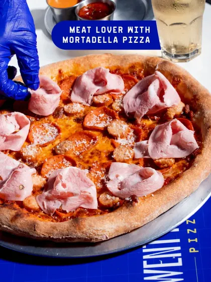 For the meat lovers, my Meat Lover with Mortadella Pizza is a must. It's loaded with various meats and topped with delicate slices of mortadella for a truly satisfying meal.