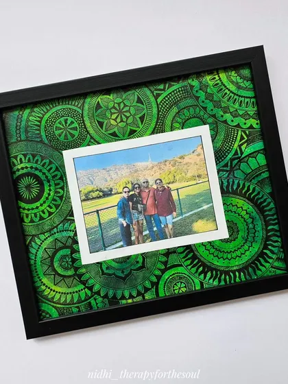 This custom photo frame features a photo of friends surrounded by a lush green mandala. It’s a wonderful way to make a cherished memory even more special.