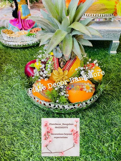 A pineapple decorated to look like a bride, complete with a small saree and jewellery. This is one of my most requested signature designs for weddings.