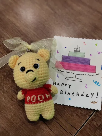 Another shot of the adorable Winnie the Pooh keychain, a perfect nostalgic gift.