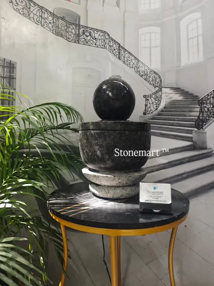 The small granite fountain for a console table. Its polished surface and minimalist design are perfect for modern decor.