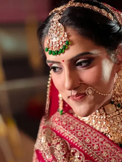 A candid portrait of the bride, her shy smile and downward glance capturing the emotions of her wedding day.