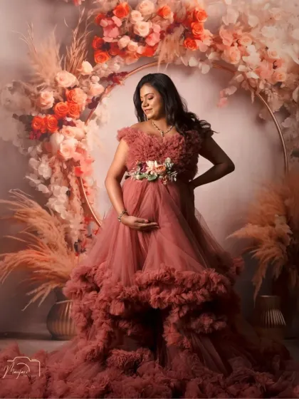The way she cradles her bump shows the deep love and connection she already feels. A beautiful solo portrait celebrating motherhood.