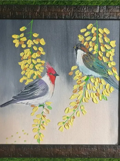 A framed canvas painting of two birds on flowering branches. I used a palette knife to create texture on the yellow flowers, making them stand out against the grey background.