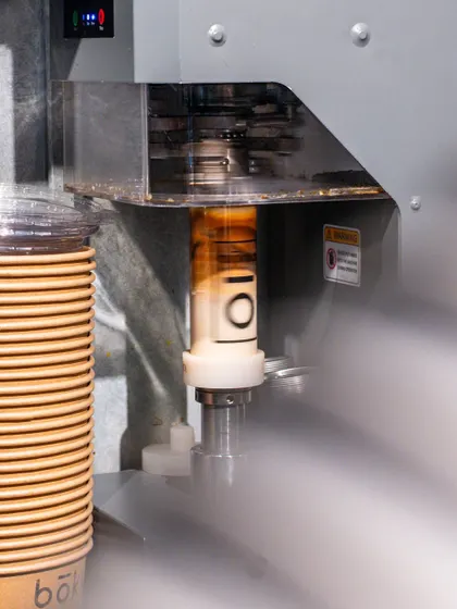 A unique coffee packaging concept from Bokka Coffee, where the cup is sealed in a can. This shot highlights the innovative branding of the cafe.