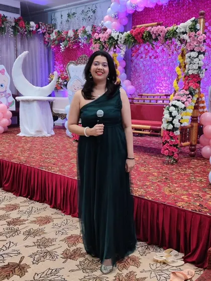 A full view of me on stage, ready to kick off the festivities for a baby shower. I love commanding the stage and getting the party started.