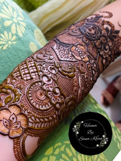 A close-up of a single arm, showcasing an incredibly dense and detailed floral pattern. Every inch is filled with artistic flair.