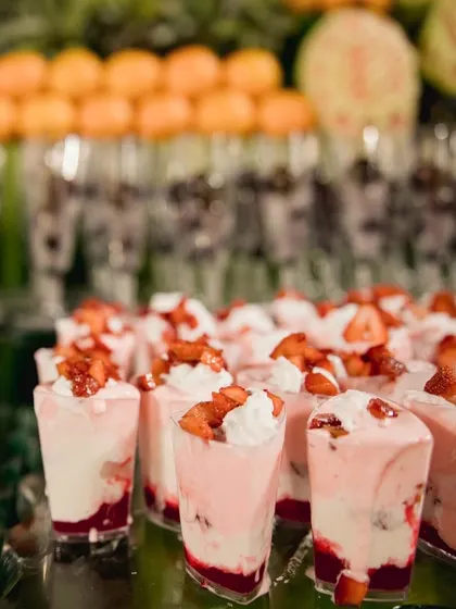 A classic and beloved dessert: fresh strawberries and cream served in individual glasses. It's a simple, elegant, and delicious treat that everyone loves.