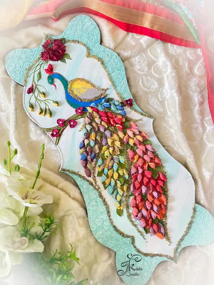 Another one of my signature peacocks, this time on a uniquely shaped panel. The tail is a rainbow of sculpted feathers, and the whole piece is framed with a sparkling turquoise border.