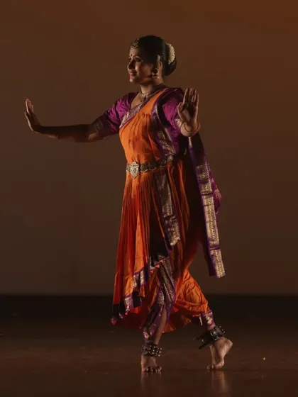 An instructor performing Bharatanatyam with poise and expression. Our classes honor the rich traditions of Indian classical dance, focusing on intricate footwork, hand gestures, and storytelling.
