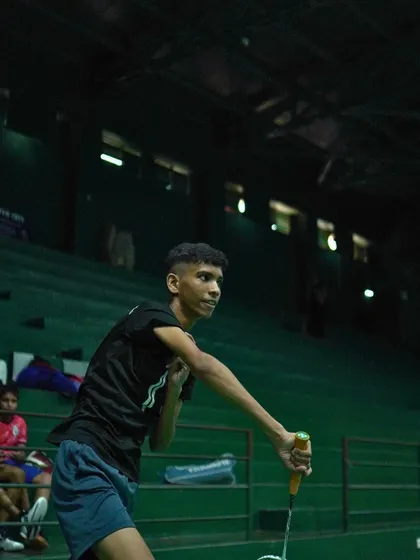 The focus and determination in a player's eyes as he prepares to return a shot.