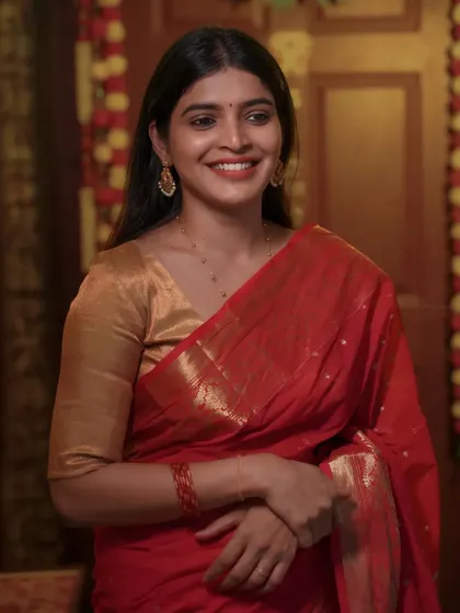 A candid, smiling version of the festive look. This captures a natural moment of joy and adds a personal touch to the series.