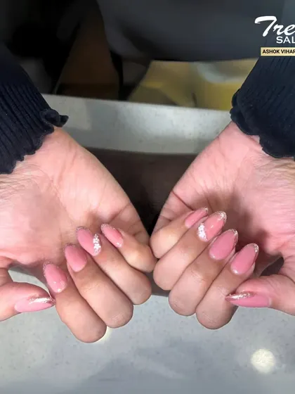 A simple yet stunning design. This manicure features a solid, glossy pink color on most nails, with a single accent nail covered in fine silver glitter for a chic and modern touch.