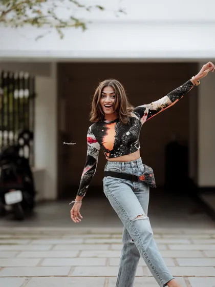 A joyful and energetic portrait capturing a candid moment of movement. I love bringing out the playful side of my subjects during a shoot.