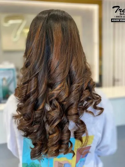 Another view of this gorgeous hair color and style, showing off the shine and perfect formation of the curls.