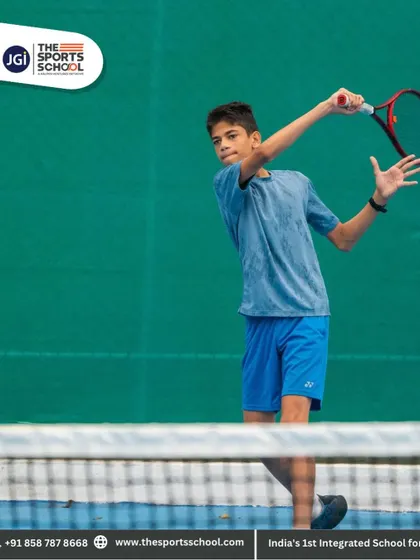 A young athlete follows through on a backhand shot, showcasing his excellent technique and balance.