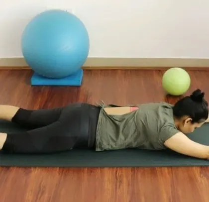 This prone exercise helps new mothers safely re-engage their back muscles and improve spinal health post-delivery.