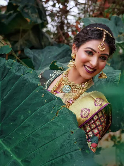 A playful and artistic shot. The bold lip and defined eyes stand out beautifully, showcasing a more dramatic bridal style.