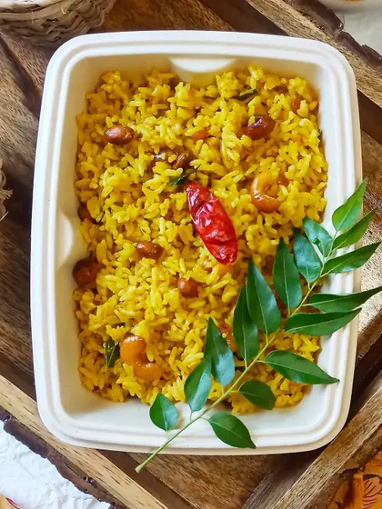 My Lemon Rice is light, zesty, and refreshing. It's a simple yet flavorful dish, tempered with mustard seeds, peanuts, and curry leaves, making it a perfect lunchbox meal.