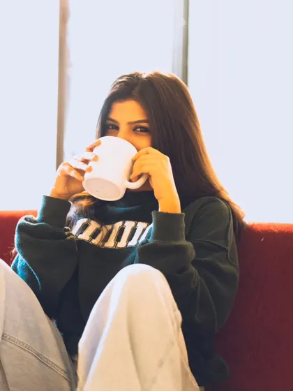 A cute and playful moment with a coffee mug. This kind of shot is great for showing personality in a lifestyle shoot.