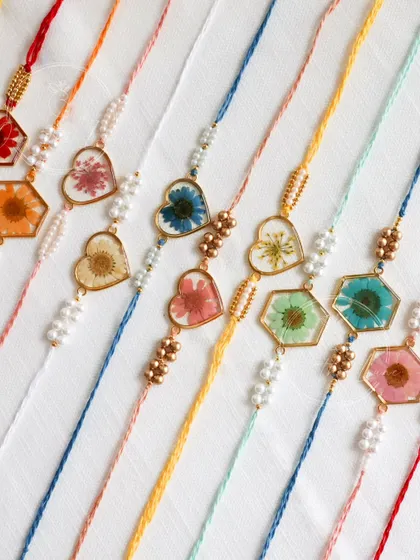 A close-up of the beautiful, handmade floral Rakhis that I include in my special Rakshabandhan gift hampers.