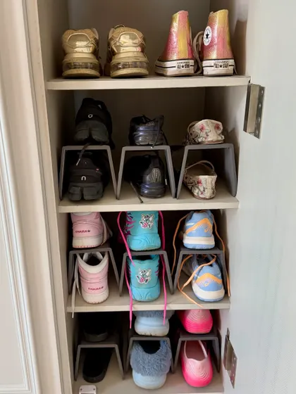 A dedicated space for a colorful sneaker collection. Using stackers allows each pair to be seen clearly, turning everyday shoes into a statement piece of the wardrobe.