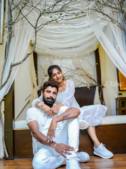 A stylish pose on the indoor bed set, showing its versatility for both romantic and modern shoots.