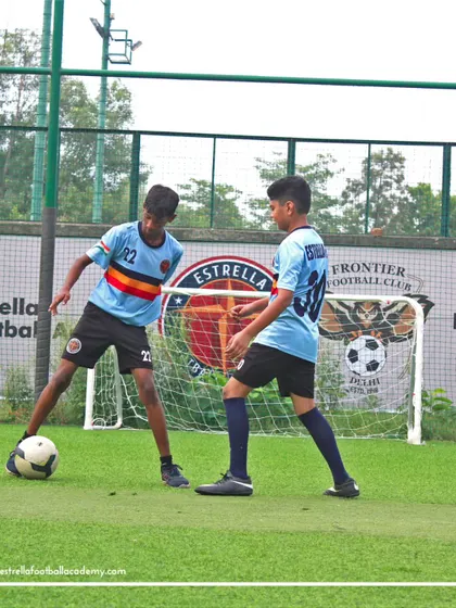 A 1v1 drill in front of the goal. This photo captures the competitive but respectful environment I cultivate in our training sessions.