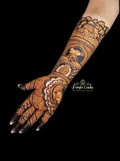 A single arm view of a heavy bridal design, showcasing the depth and detail of the traditional motifs.