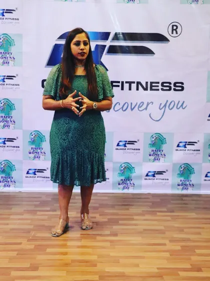 Here I am addressing our wonderful community during our Women's Day event. It's a privilege to create a space where women feel empowered, celebrated, and strong.