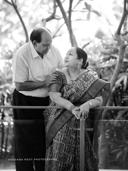 A timeless black and white portrait of a couple celebrating their 50th anniversary. This image captures a lifetime of shared glances and quiet understanding, proving that love stories only get richer with time.