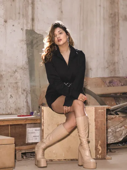 A portrait from a junkyard shoot, showing how I can transform an unconventional indoor space into a unique photo location. The rustic background contrasts with the modern styling for an edgy look.