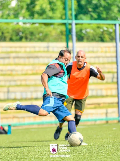 A player takes a powerful shot on goal. Every match is filled with moments of skill and determination, making for an exciting tournament.