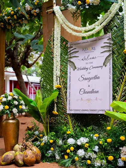 The entrance to the 'Banana Grove' themed wedding. I used woven coconut leaves, banana plants, and traditional flowers like jasmine and marigolds to create a rustic and authentic welcome for guests.