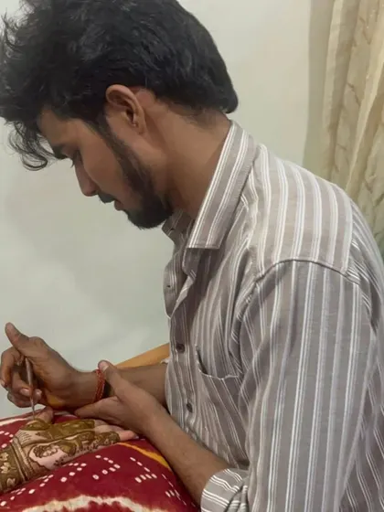 A candid photo of me at work, providing professional mehandi service at the client's home.
