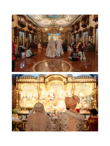 A wide shot showing the scale and beauty of the temple wedding, with the couple at the center of the sacred space.