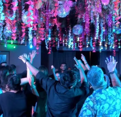 Hands in the air! The crowd is loving the Bollywood music.