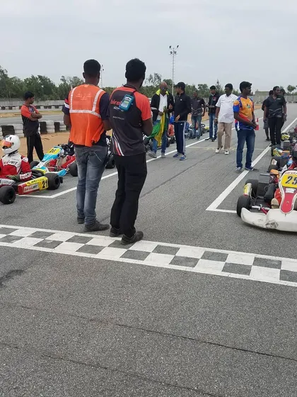A view from the grid, showing the karts lined up and ready for the start of the race. We handle all logistics so the driver's only focus is the track ahead.