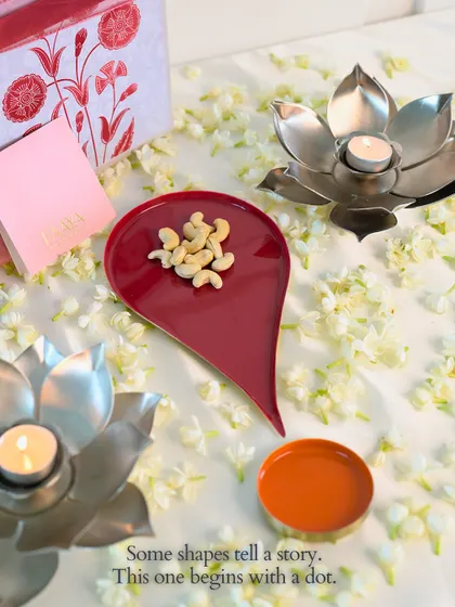 Some shapes tell a story. This one begins with a dot. Our Bindu plate, shown here with cashews, is designed to bring meaning to your celebrations.