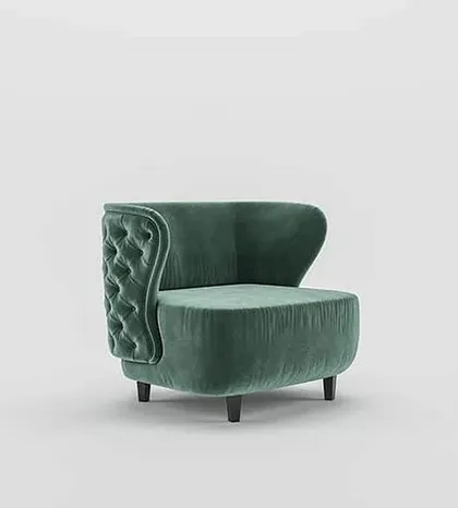 This angle highlights the unique, asymmetric wingback design of our tufted armchair, a modern twist on a classic silhouette.