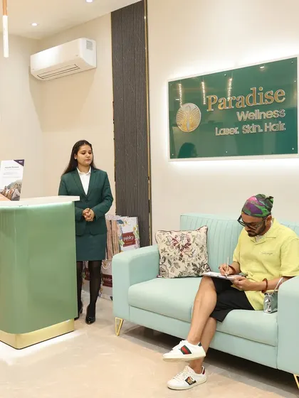 The real-life photo that inspired the illustration. A client fills out his paperwork in our comfortable waiting area before his appointment, showcasing the calm and organized experience at Paradise Wellness.