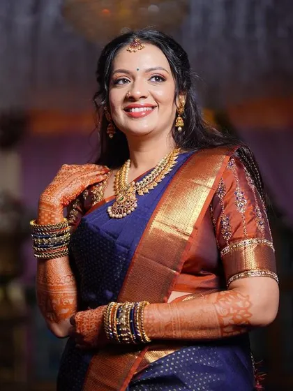 This bride looks absolutely gorgeous for her engagement. The makeup is radiant and glowing, with a focus on her eyes and a beautiful smile.