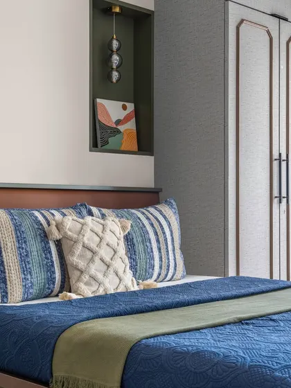 Another view of the grandparents' bedroom, highlighting the built-in niche with a pendant light, which serves as a perfect spot for a piece of art.