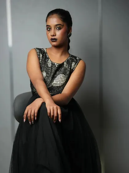 A dark, dramatic, and edgy look from a student portfolio shoot, showcasing versatility beyond traditional bridal makeup.